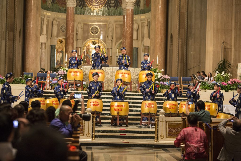 Youths from The Holy Martyrs Catholic Church Arlington, VA., perform traditional music during an Asian pilgrimage at Washington basilica