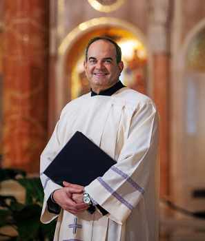 Music Director Peter Latona in white robe