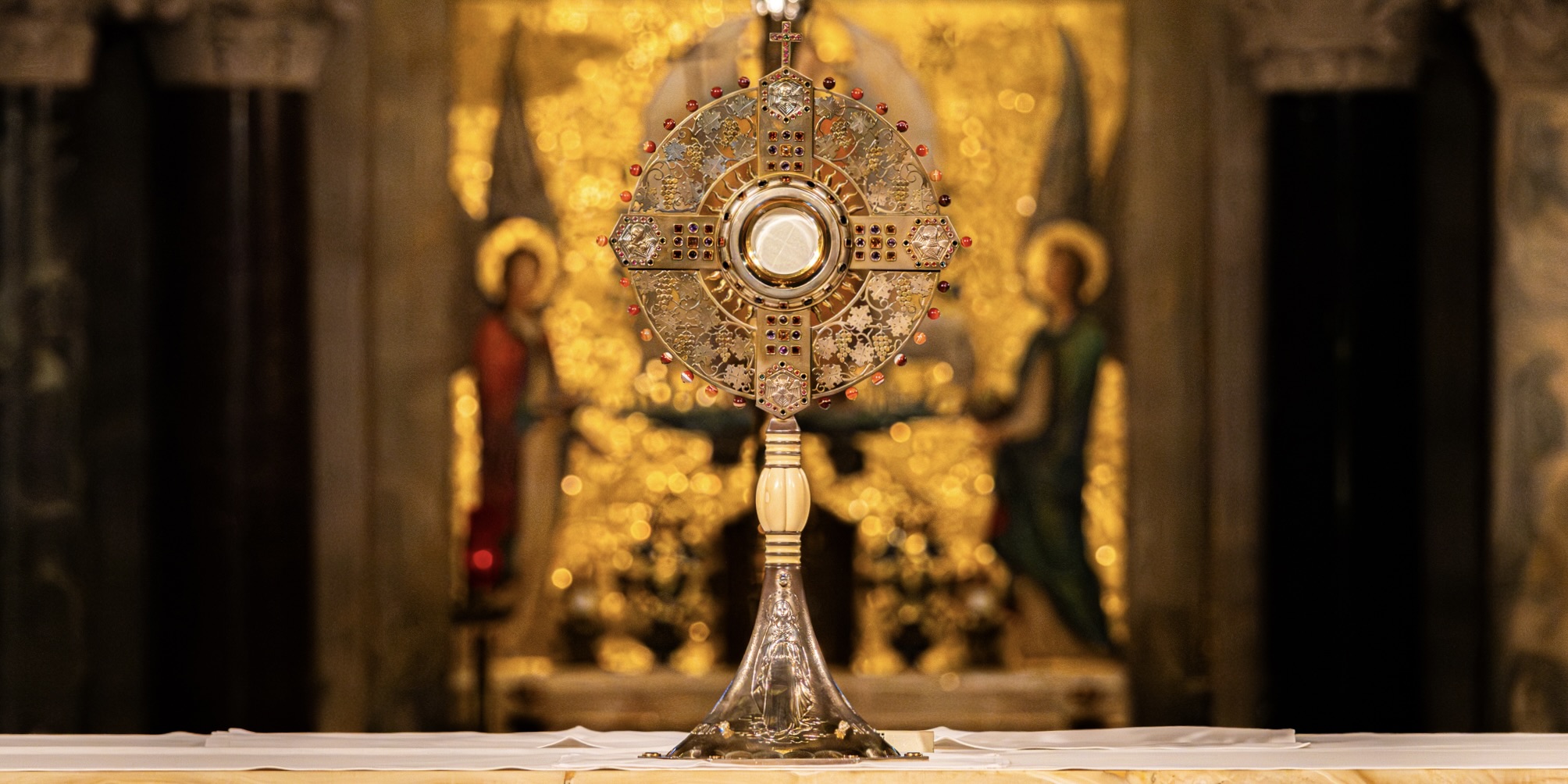 A monstrance is shown sitting atop an altar in the Crypt Church