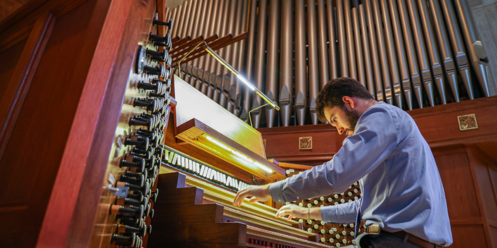 Adam Chlebek playing the organ in the Basilica