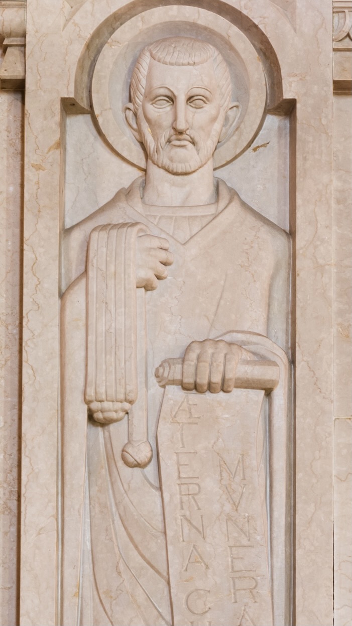 A marble relief sculpture of Saint Ambrose