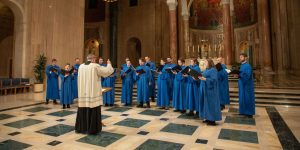 Dr. Peter Latona directs the Basilica Choir in song in the Great Upper Church