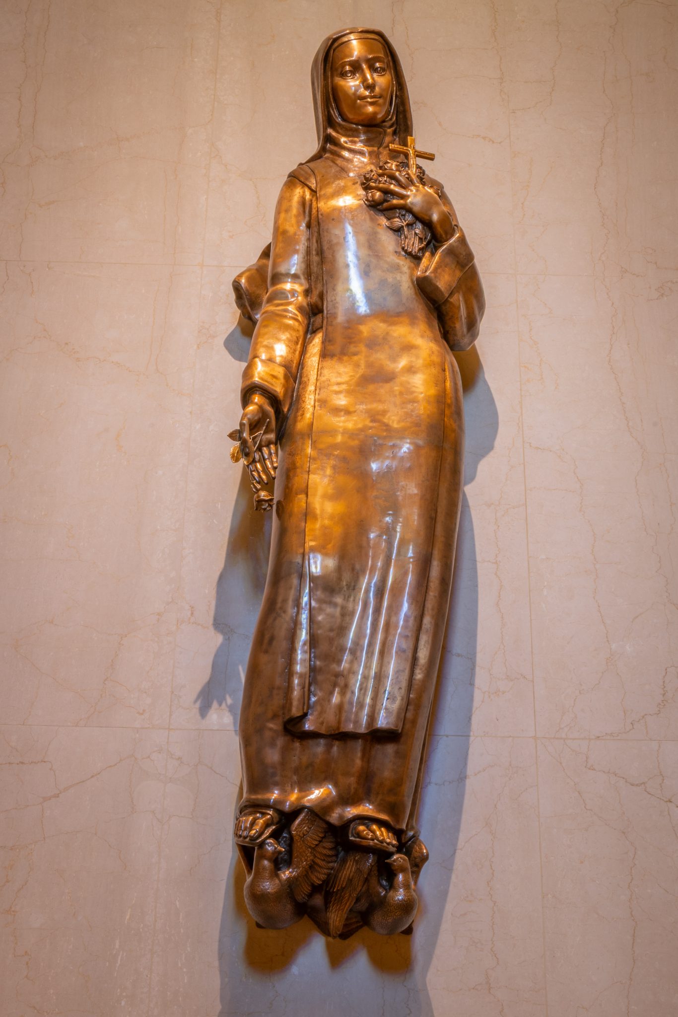 A bronze statue of St. Therese of Lisieux
