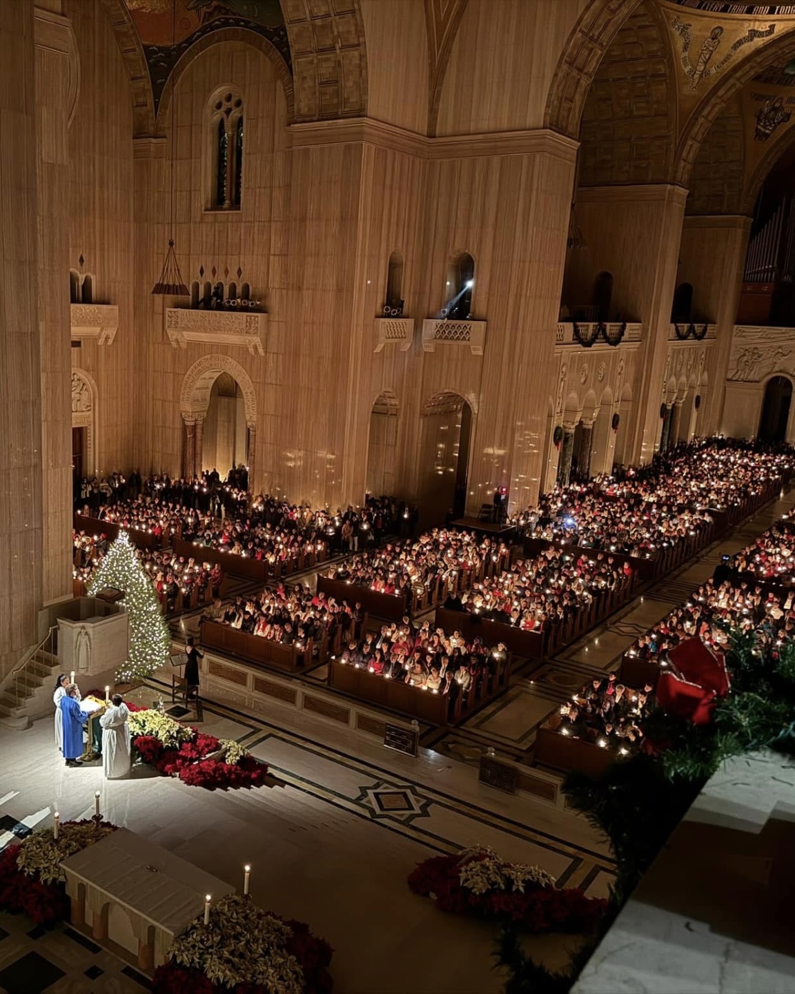 The Sanctuary is filled with people attending Mass on Christmas night