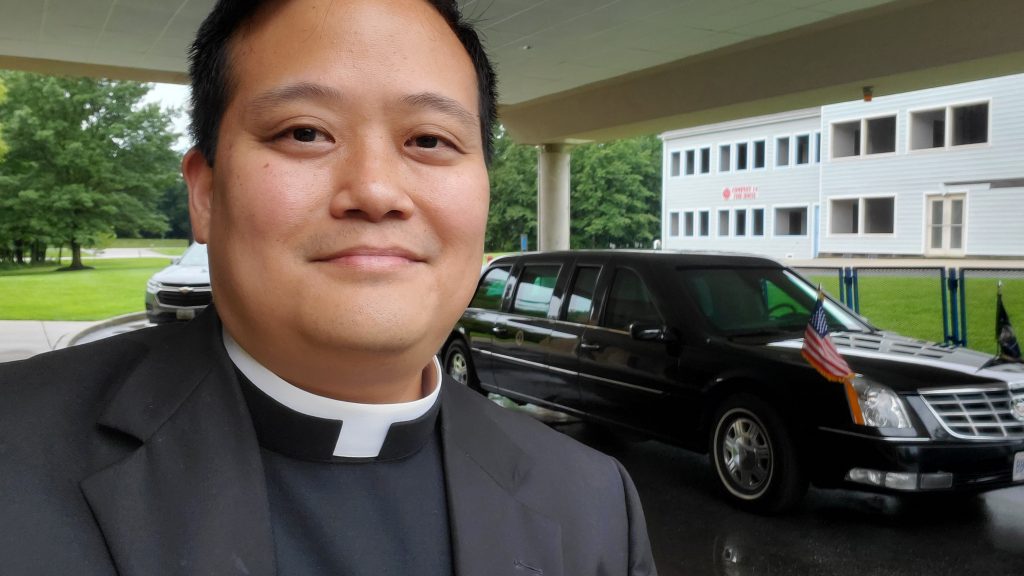 Father Mel outside the Secret Service training center