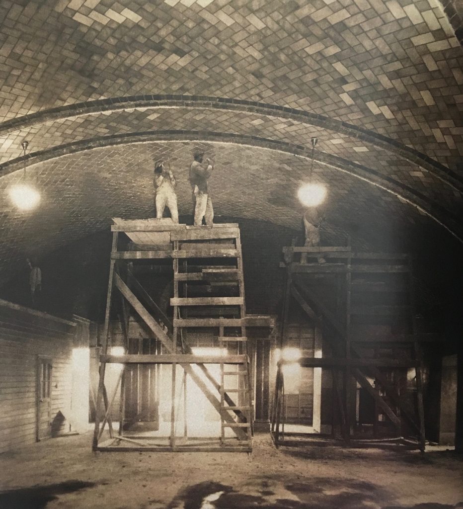 Workers perform construction for the Crypt Church in its early stages.