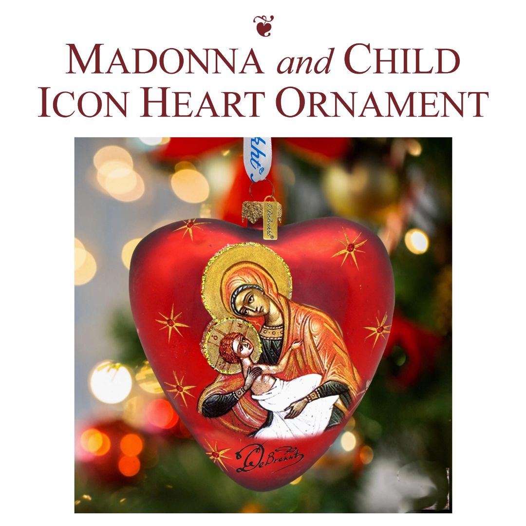 A red heart ornament with Mary and Jesus
