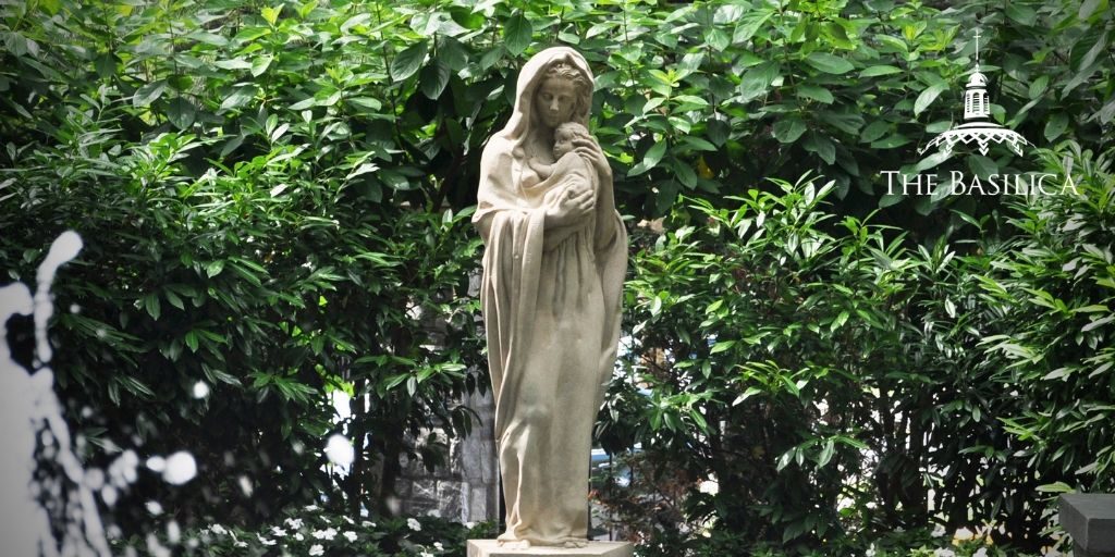 Mary with infant Jesus statue in Rosary Walk and Garden