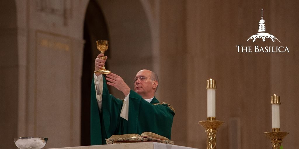 Msgr. Rossi performing sacraments