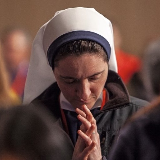 A nun prays at the National Shrine 