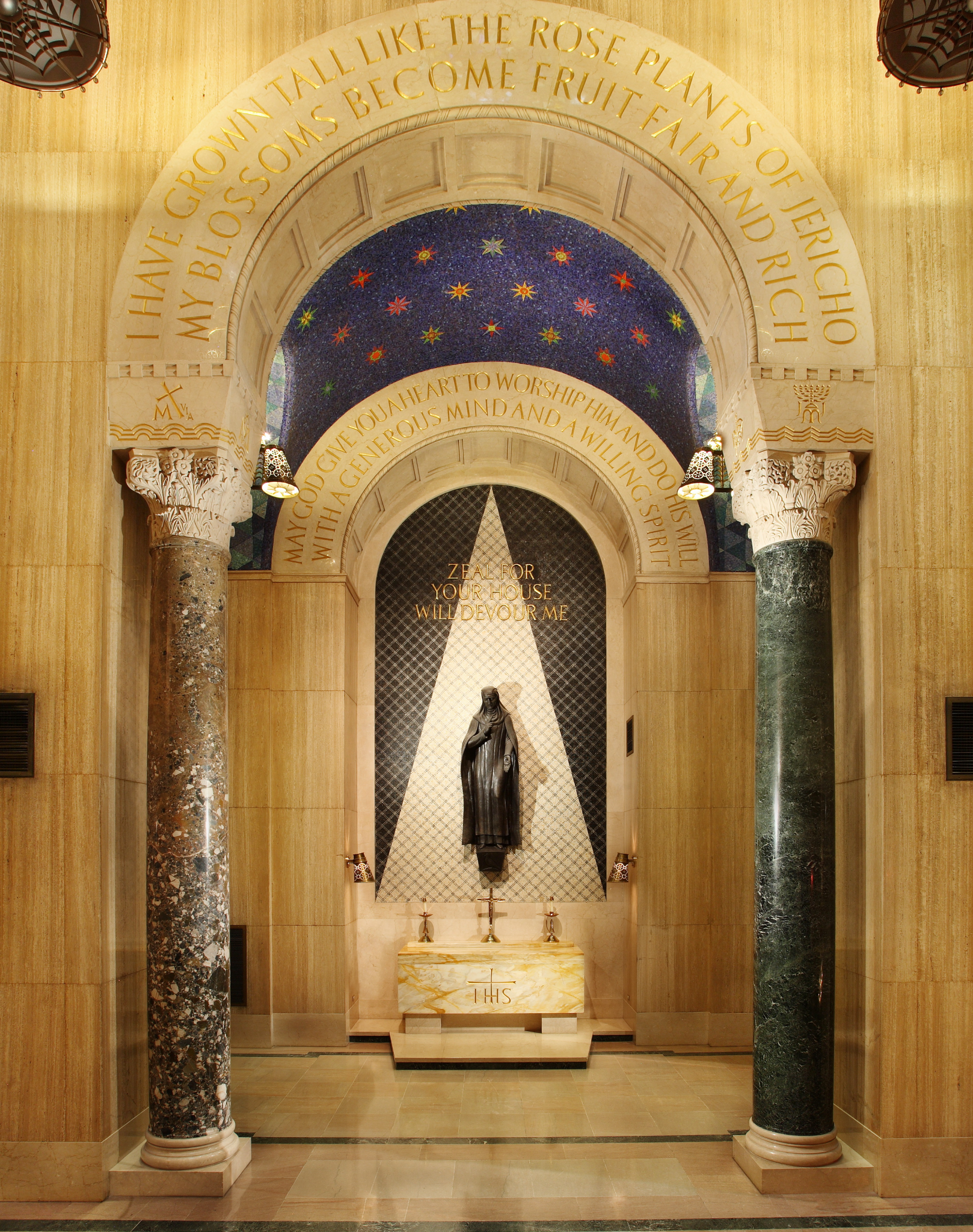 St. Catherine depicted in burnished bronze in the St. Catherine of Siena Chapel.
