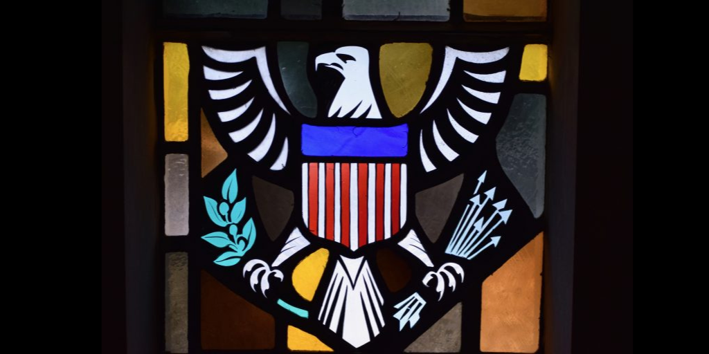 The Seal of the USA is portrayed in stained glass