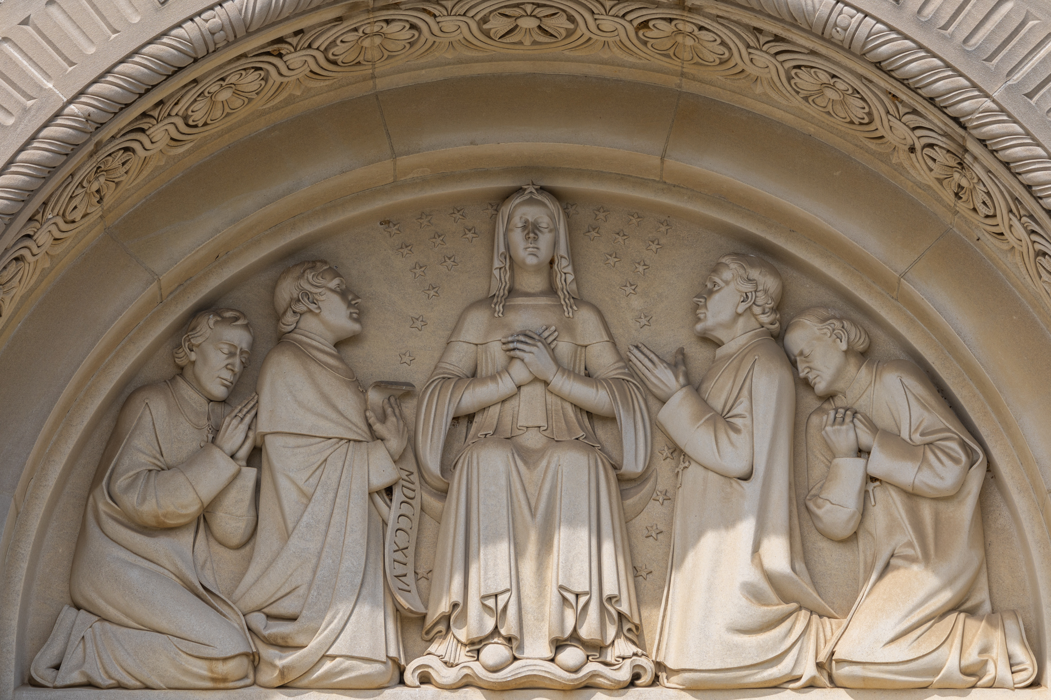 A sculpture of American bishops designating Mary as patroness of the United States