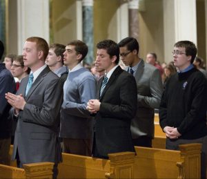 Young men praying at the Basilica